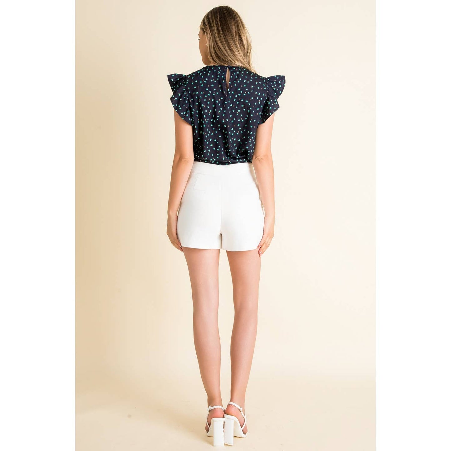 Top- Navy Flutter Sleeve with Scattered Green Dots