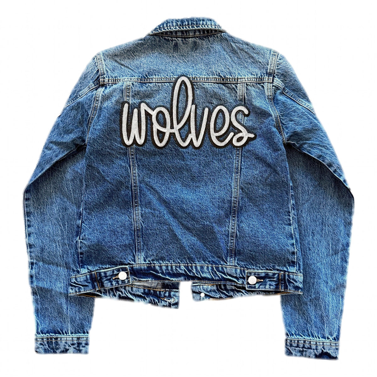 Back of medium-wash denim jacket with sequin wolves script patch
