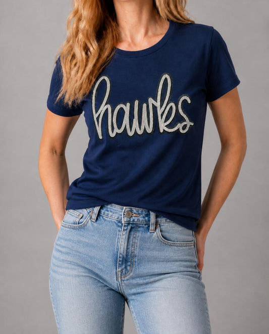 Close-up of the silver sequin hawks script on a model