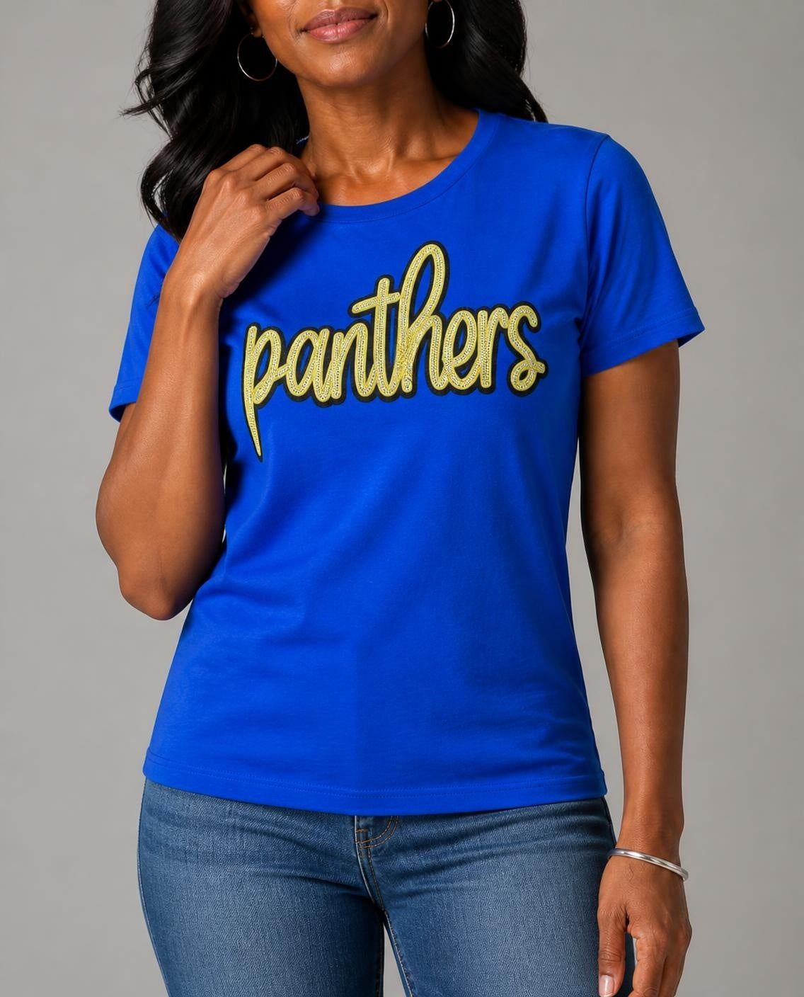 Close-up of the gold sequin panthers script on a model